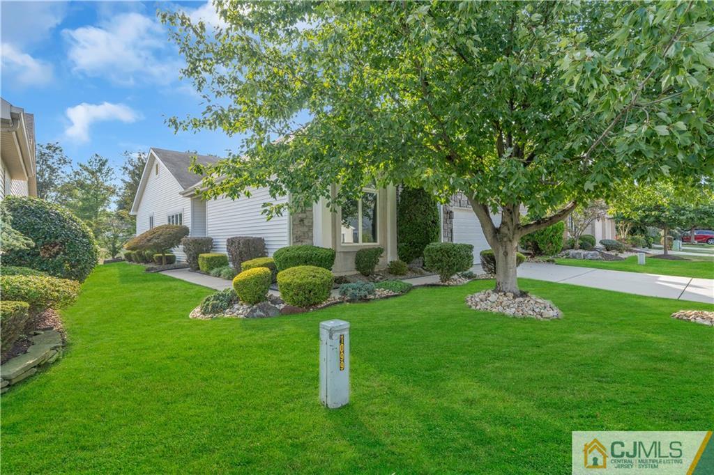 45 Harwood Road Monroe Township, NJ 08831 - Photo 4 of 35 a front view of a house with garden