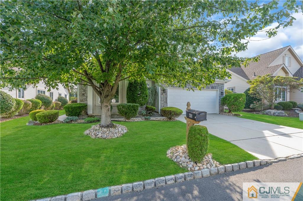 45 Harwood Road Monroe Township, NJ 08831 - Photo 5 of 35 a front view of a house with garden