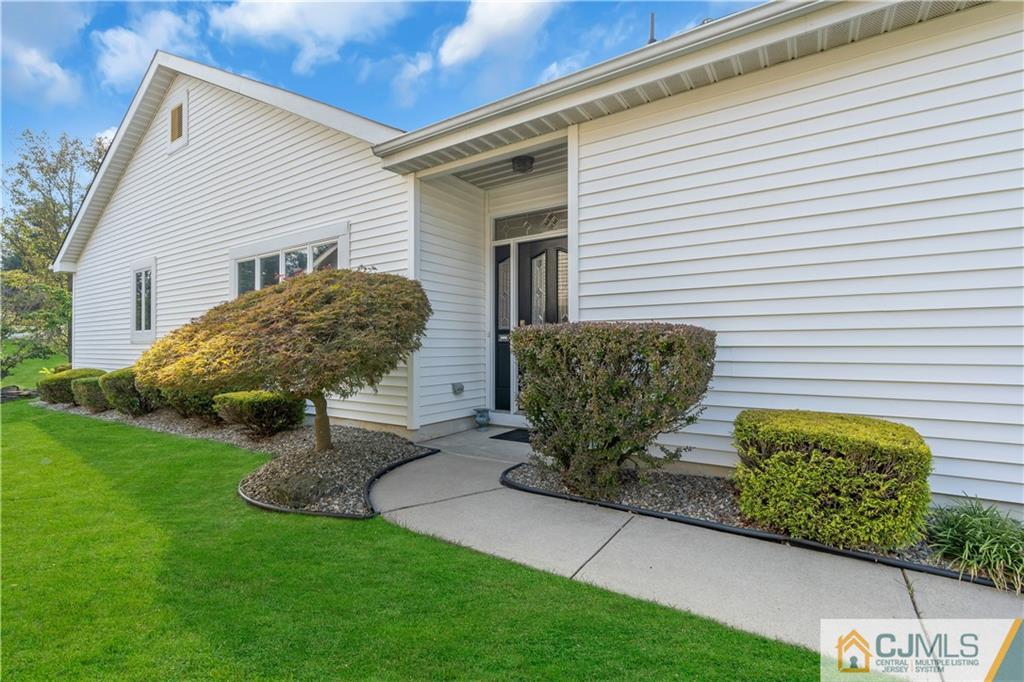 45 Harwood Road Monroe Township, NJ 08831 - Photo 8 of 35 a view of a chair and table in backyard of the house