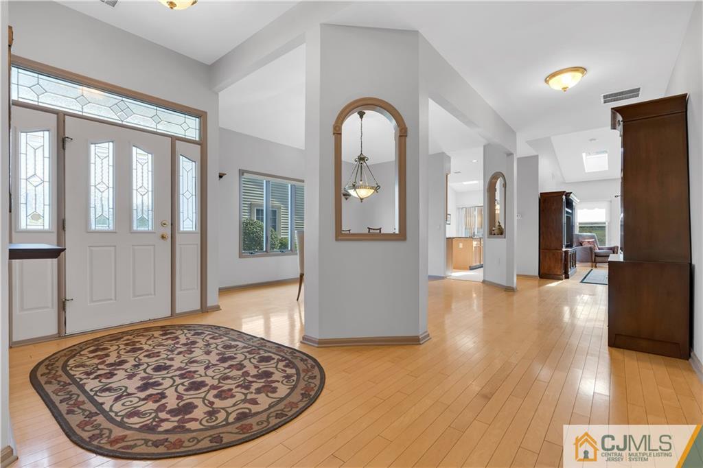 45 Harwood Road Monroe Township, NJ 08831 - Photo 10 of 35 a view of a hallway with wooden floor windows and livingroom