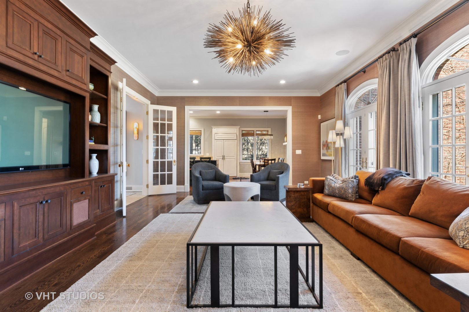795 Grove Street Glencoe, IL 60022 - Photo 13 of 38 a living room with furniture a flat screen tv and a large window