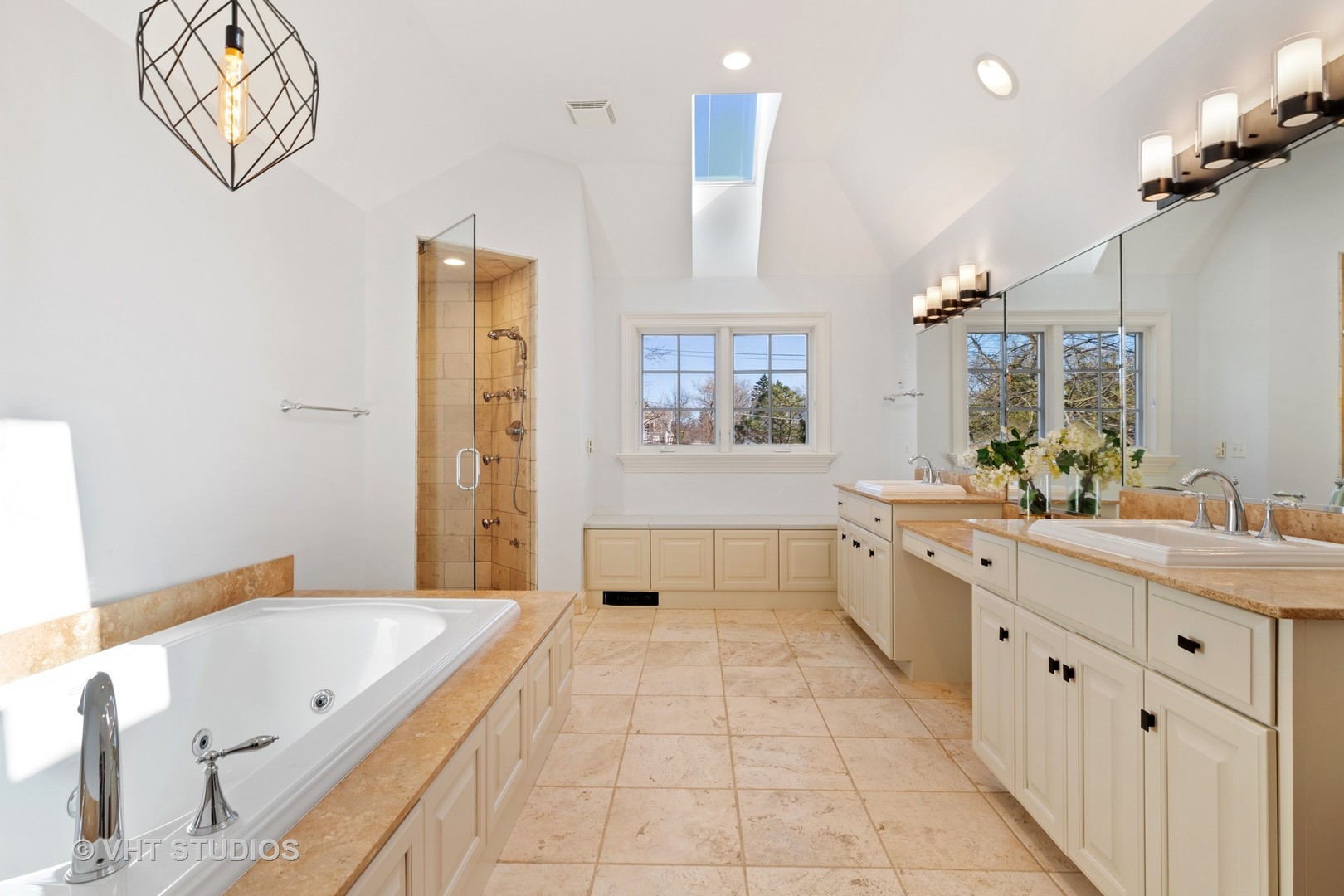795 Grove Street Glencoe, IL 60022 - Photo 19 of 38 a large bathroom with a granite countertop tub a sink and a large mirror