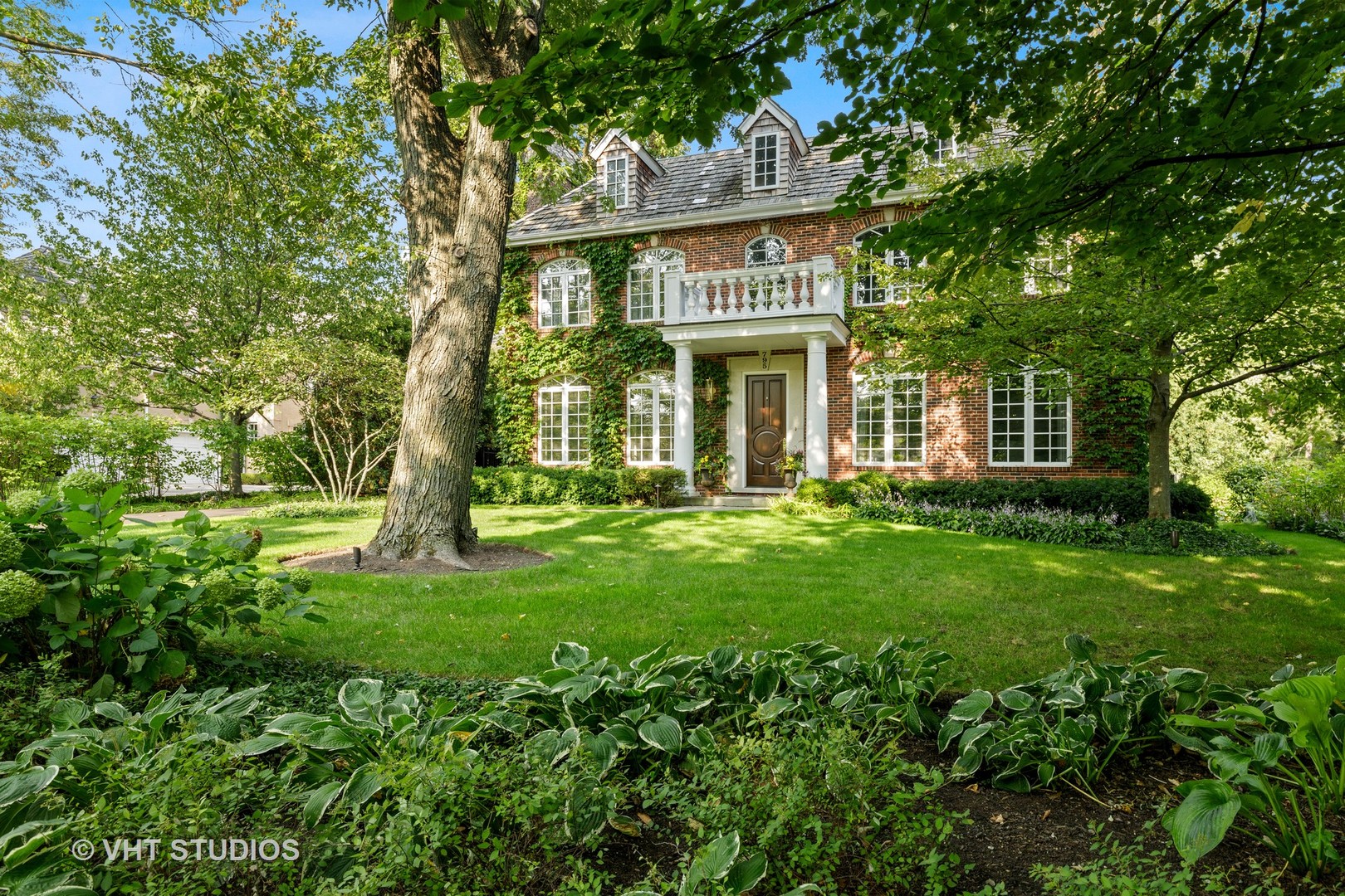 795 Grove Street Glencoe, IL 60022 - Photo 3 of 38 a view of a house with a yard