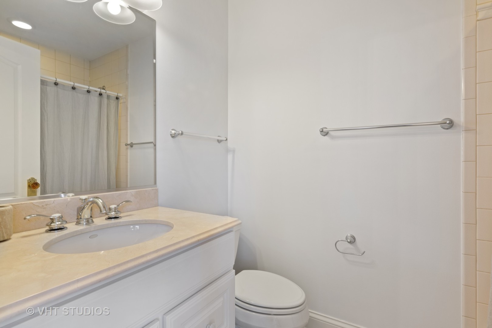 795 Grove Street Glencoe, IL 60022 - Photo 21 of 38 a bathroom with a granite countertop sink toilet and shower