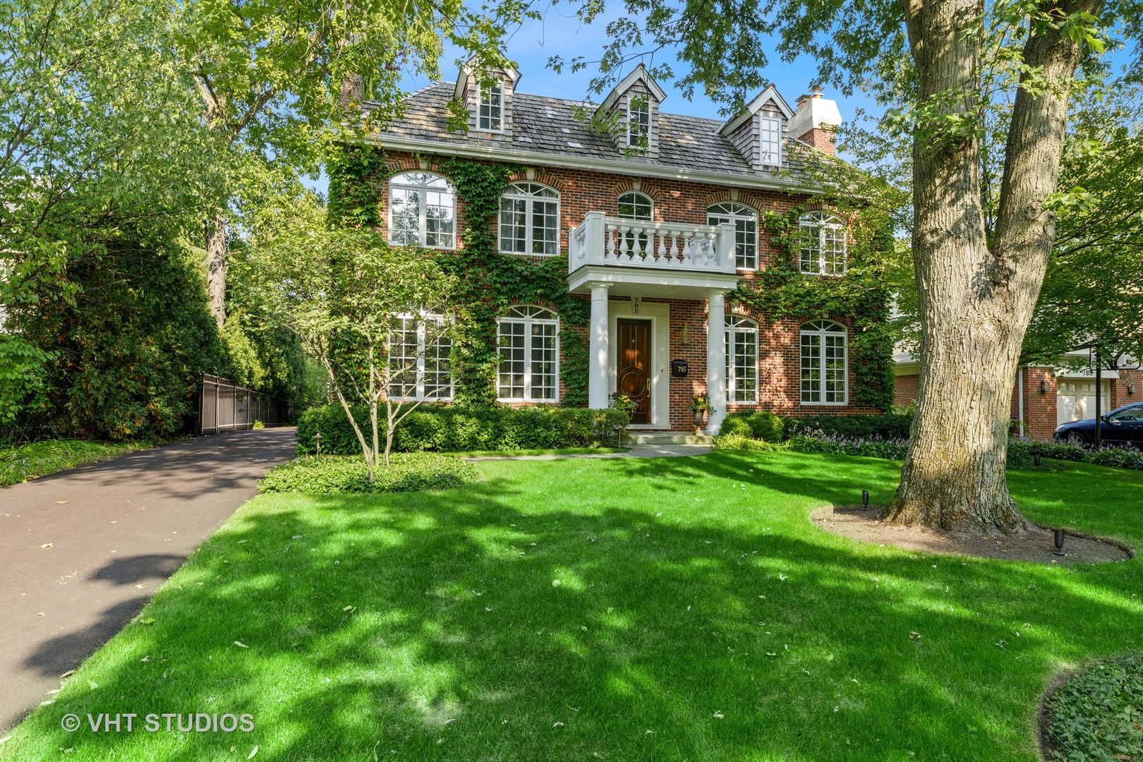 795 Grove Street Glencoe, IL 60022 - Photo 4 of 38 a view of a house with a yard and plants
