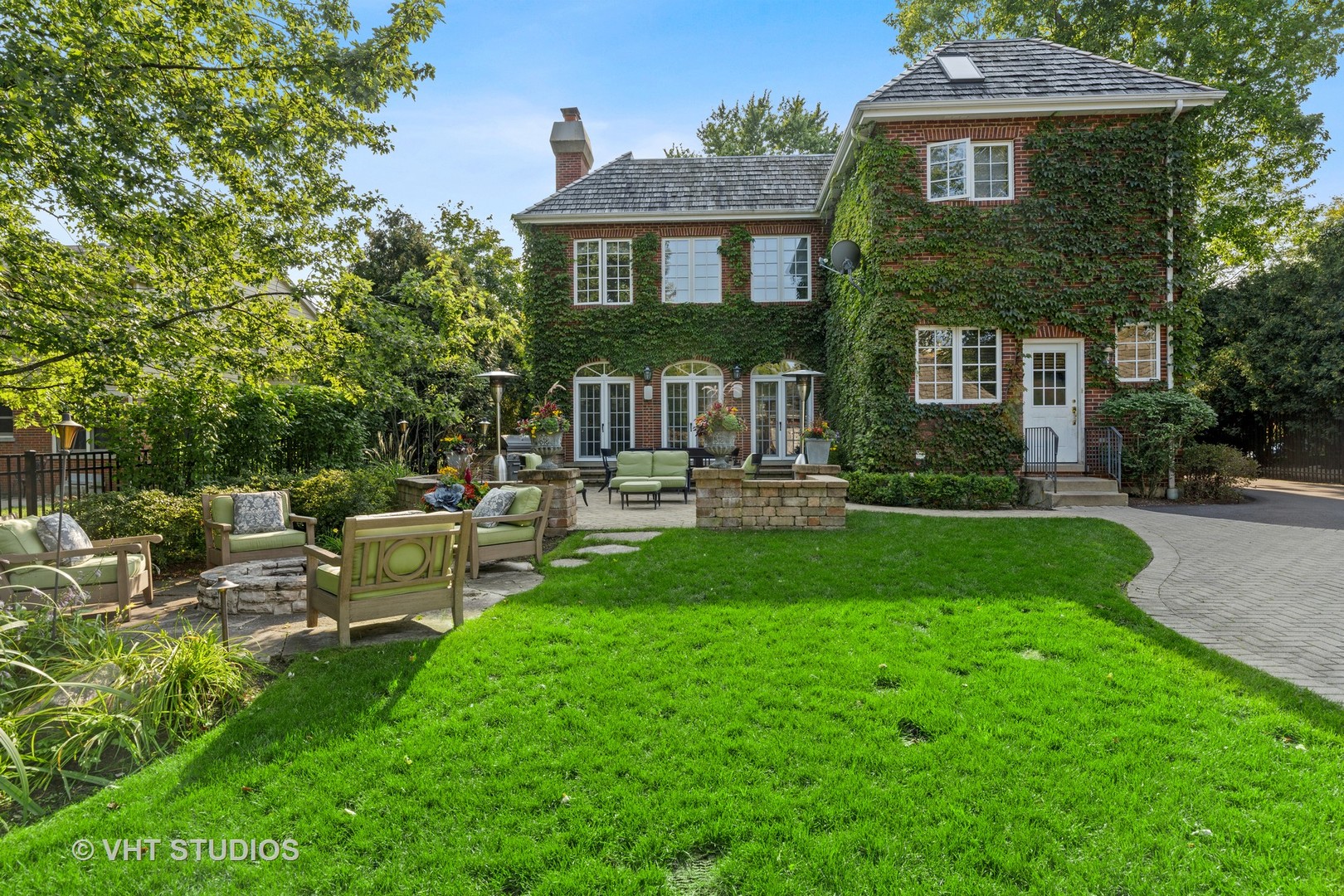 795 Grove Street Glencoe, IL 60022 - Photo 33 of 38 a view of a house with a yard and sitting area