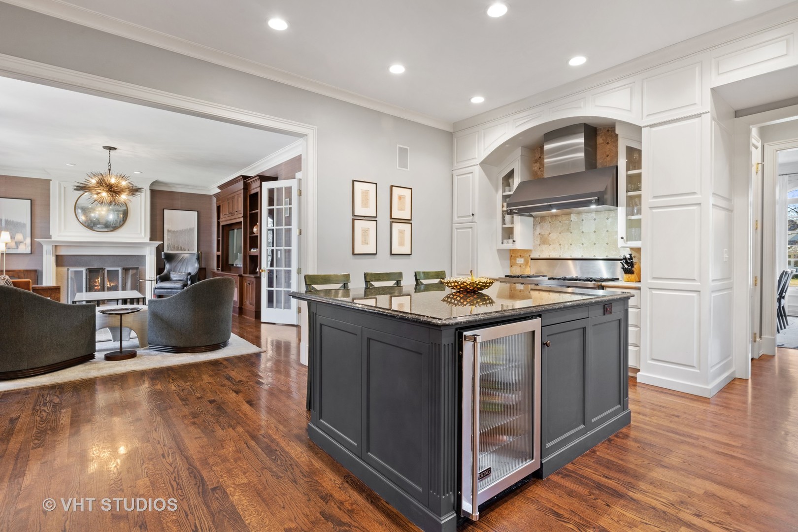 795 Grove Street Glencoe, IL 60022 - Photo 9 of 38 a kitchen with kitchen island granite countertop a stove and cabinets
