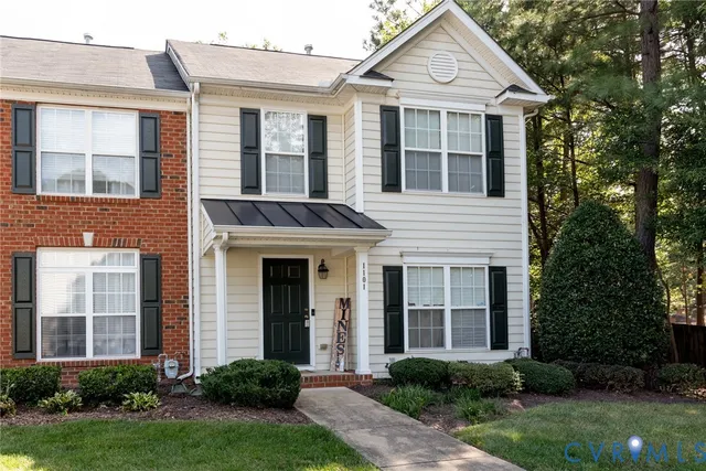 a view of backyard with a chair under an umbrella