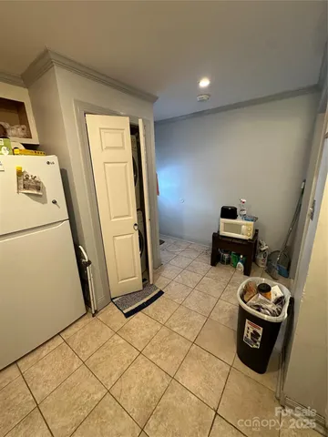 a kitchen with a sink a stove and cabinets