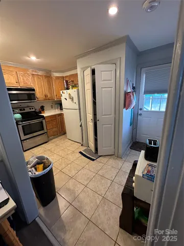 a living room with furniture a flat screen tv and a table