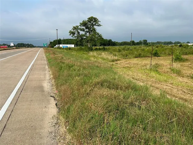 a view of swimming pool with a yard