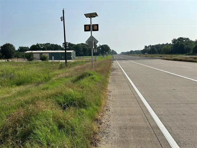 a view of a big yard with potted plants