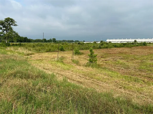 a view of a swimming pool and a yard