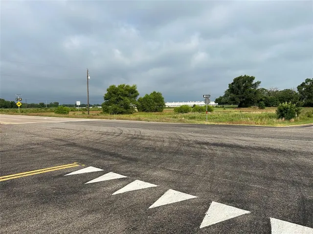 a view of an ocean and trees