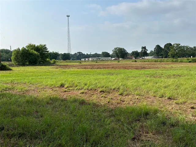 a view of a large body of water with a building in the background