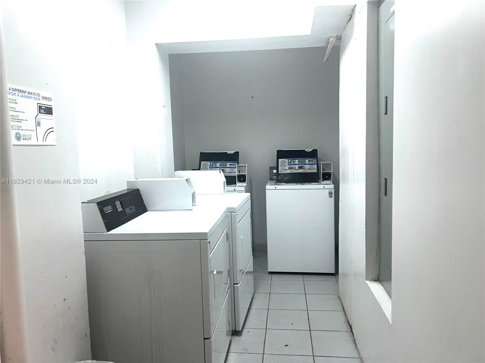 6345 Collins Avenue, Unit 635 Miami Beach, FL 33141 - Photo 18 of 28 a utility room with dryer and washer
