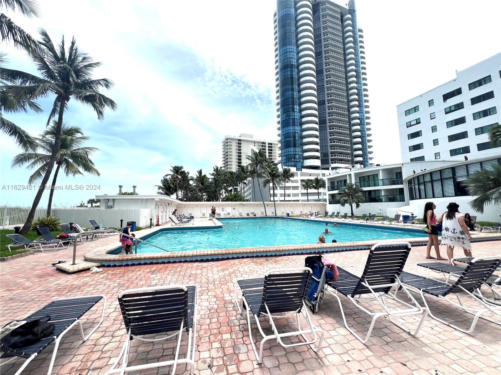 6345 Collins Avenue, Unit 635 Miami Beach, FL 33141 - Photo 22 of 28 a terrace with outdoor seating and city view