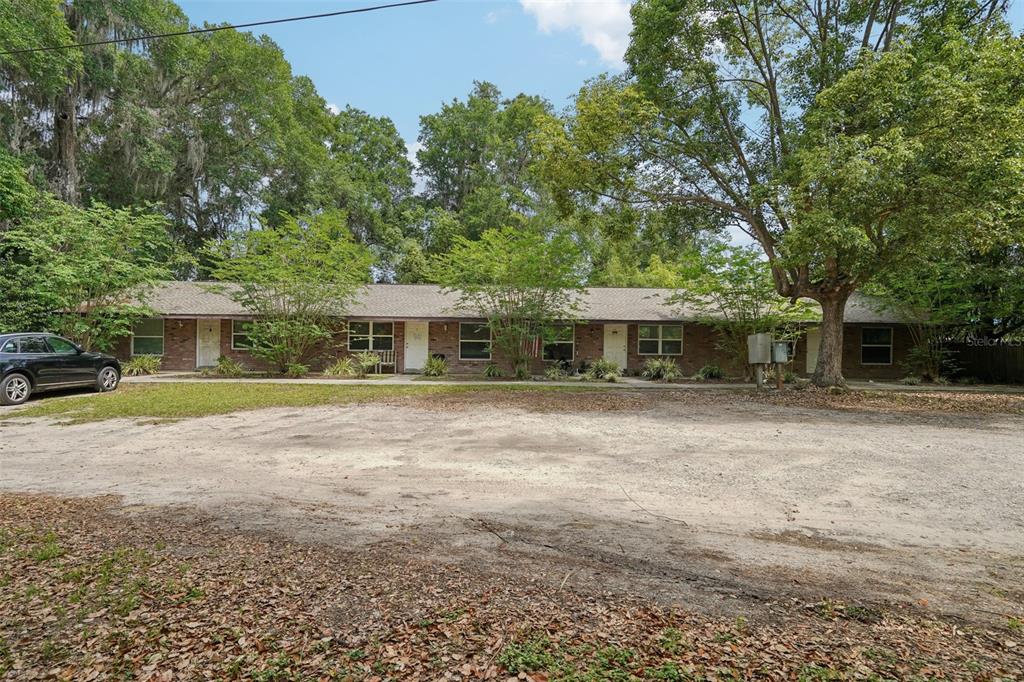 6101 Southeast Foss Road Belleview, FL 34420 - Photo 1 of 1 a front view of a house with a yard