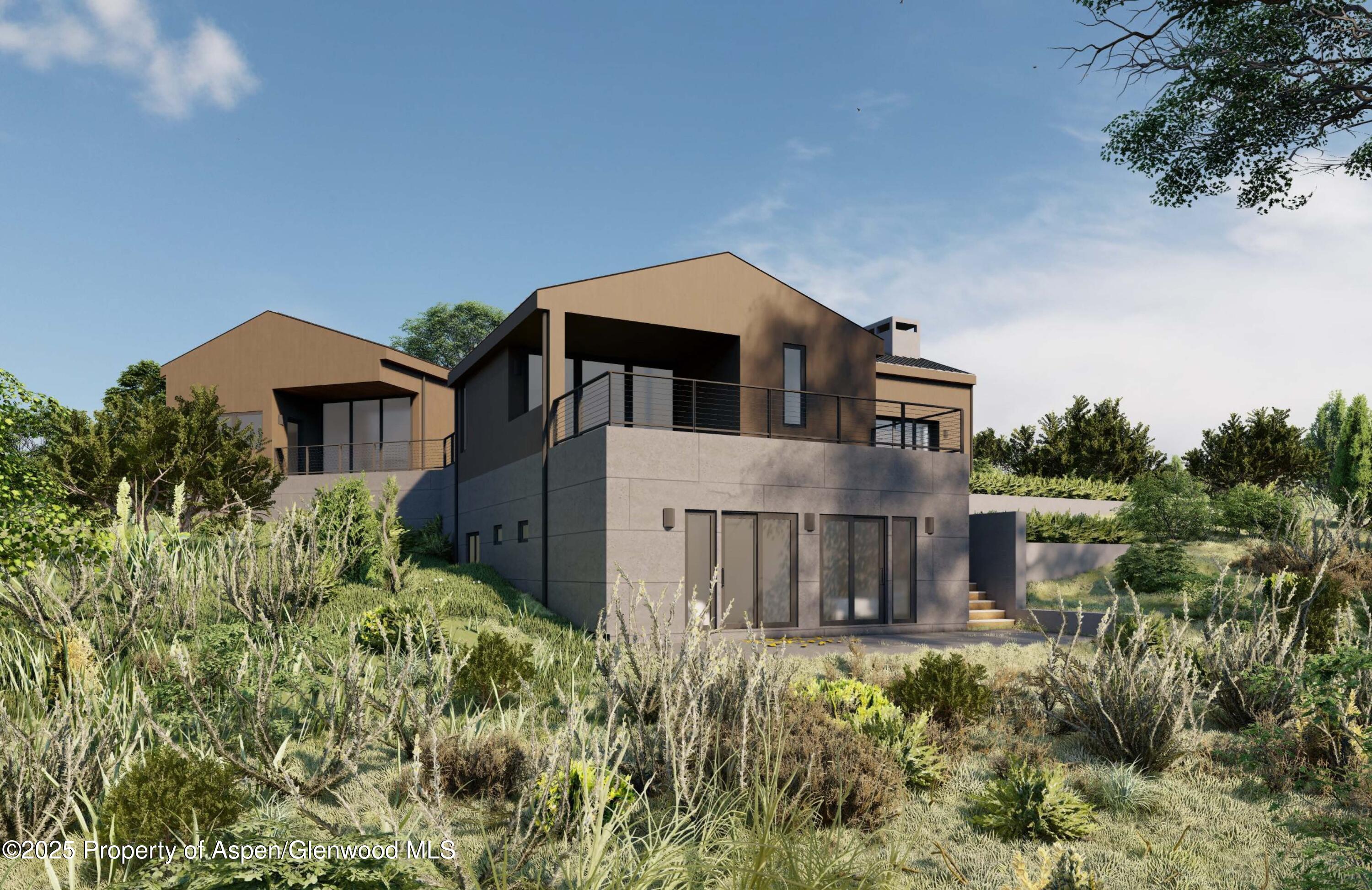 151 Monarch Road Glenwood Springs, CO 81601 - Photo 4 of 6 a front view of a house with a yard