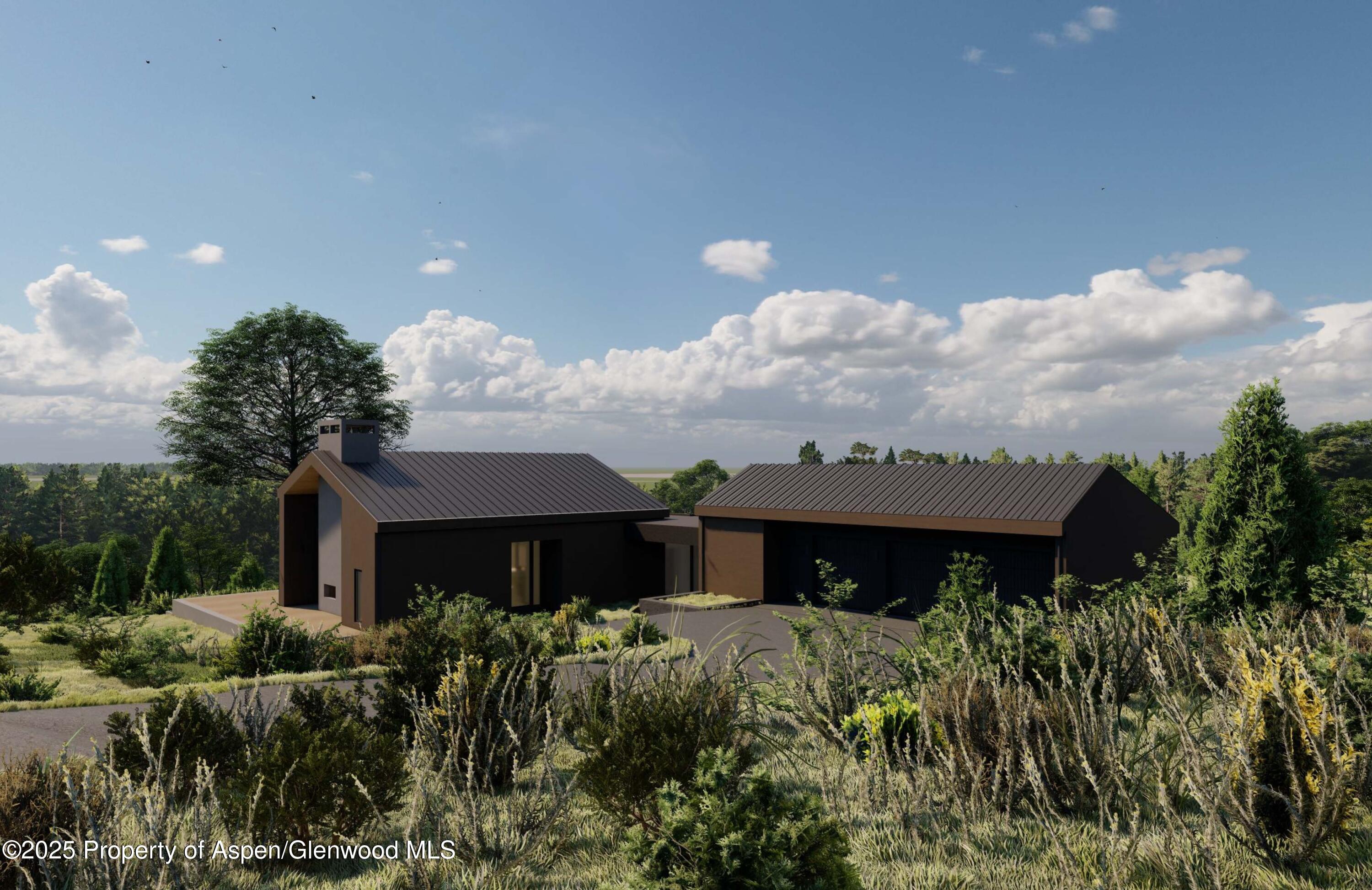 151 Monarch Road Glenwood Springs, CO 81601 - Photo 5 of 6 a view of a house with a yard and potted plants