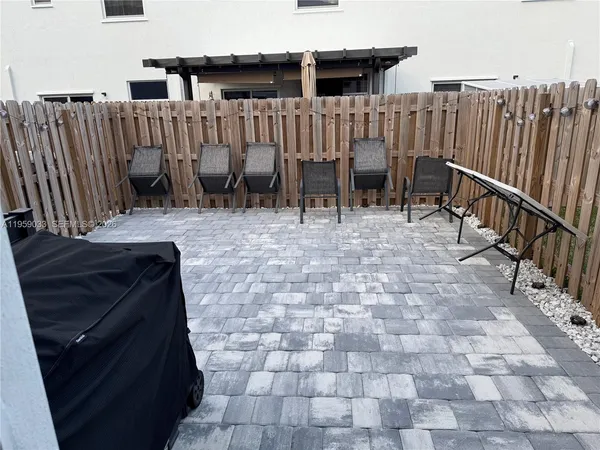 a view of a backyard with wooden floor