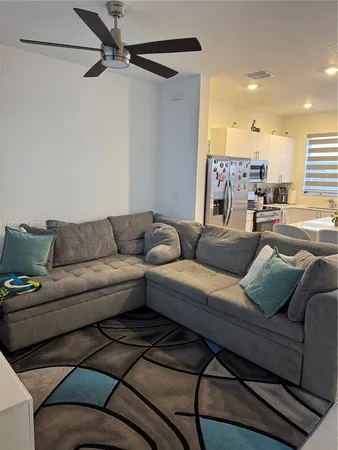 a living room with furniture and a couch