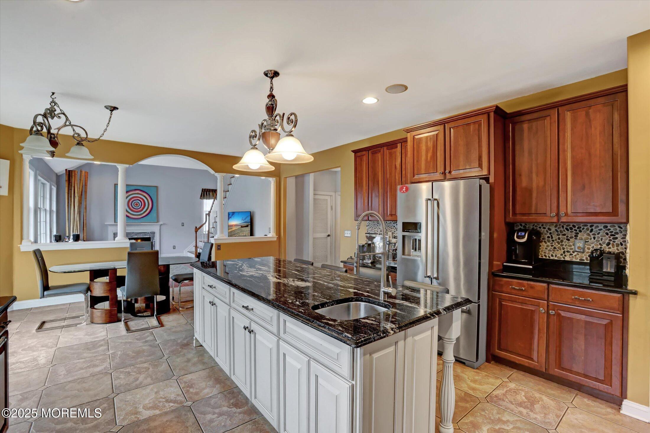 330 Randolph Road Freehold, NJ 07728 - Photo 12 of 63 a kitchen with stainless steel appliances granite countertop a sink stove and refrigerator