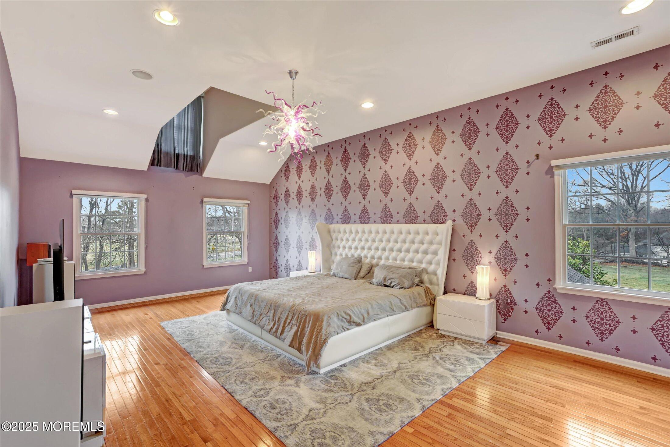 330 Randolph Road Freehold, NJ 07728 - Photo 13 of 63 a bedroom with a large bed and a chandelier