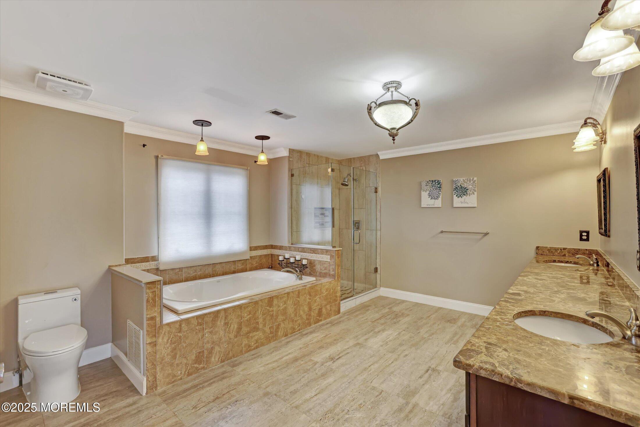 330 Randolph Road Freehold, NJ 07728 - Photo 15 of 63 a spacious bathroom with a granite countertop sink toilet and a mirror