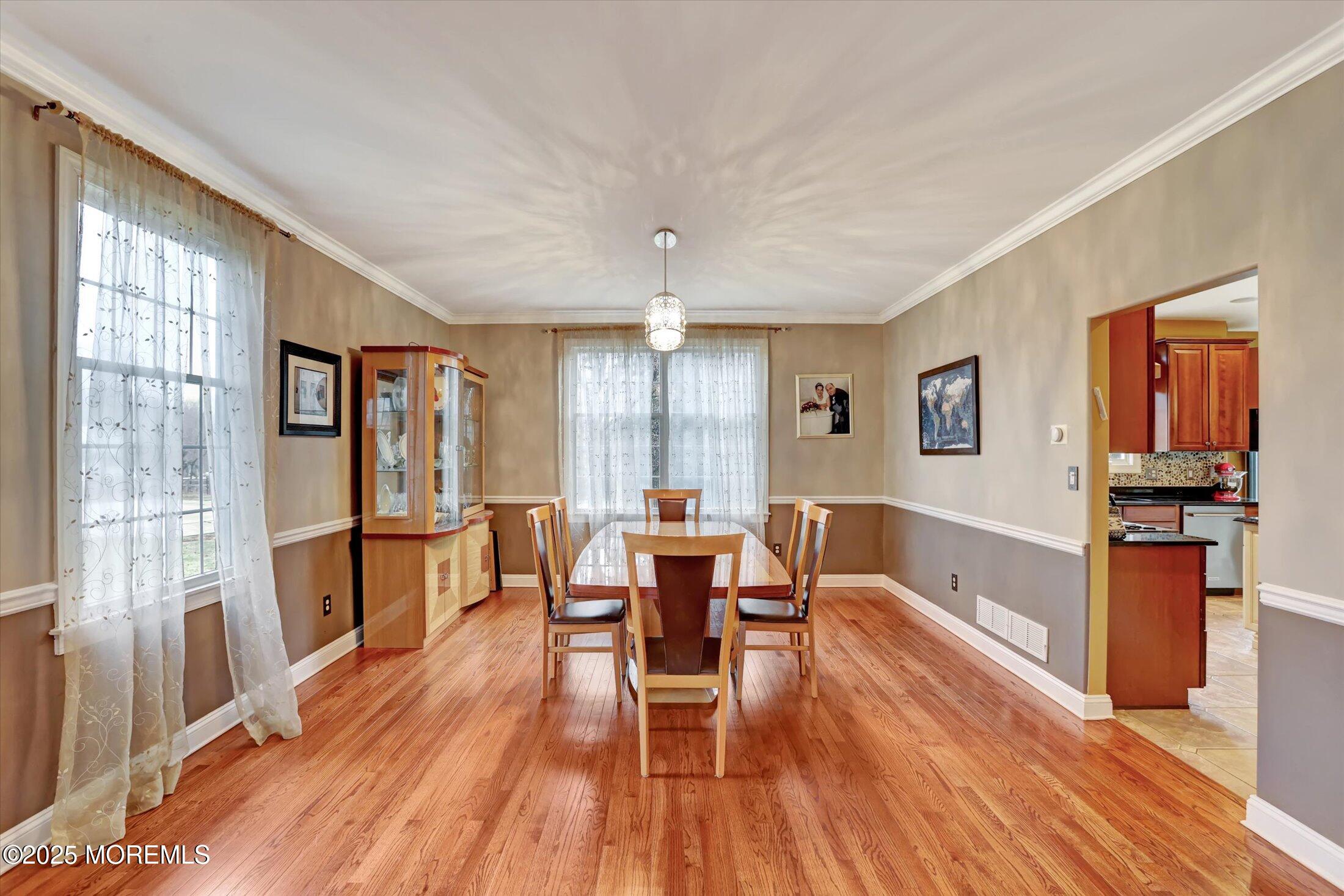 330 Randolph Road Freehold, NJ 07728 - Photo 17 of 63 a dining room with wooden floor and stainless steel appliances
