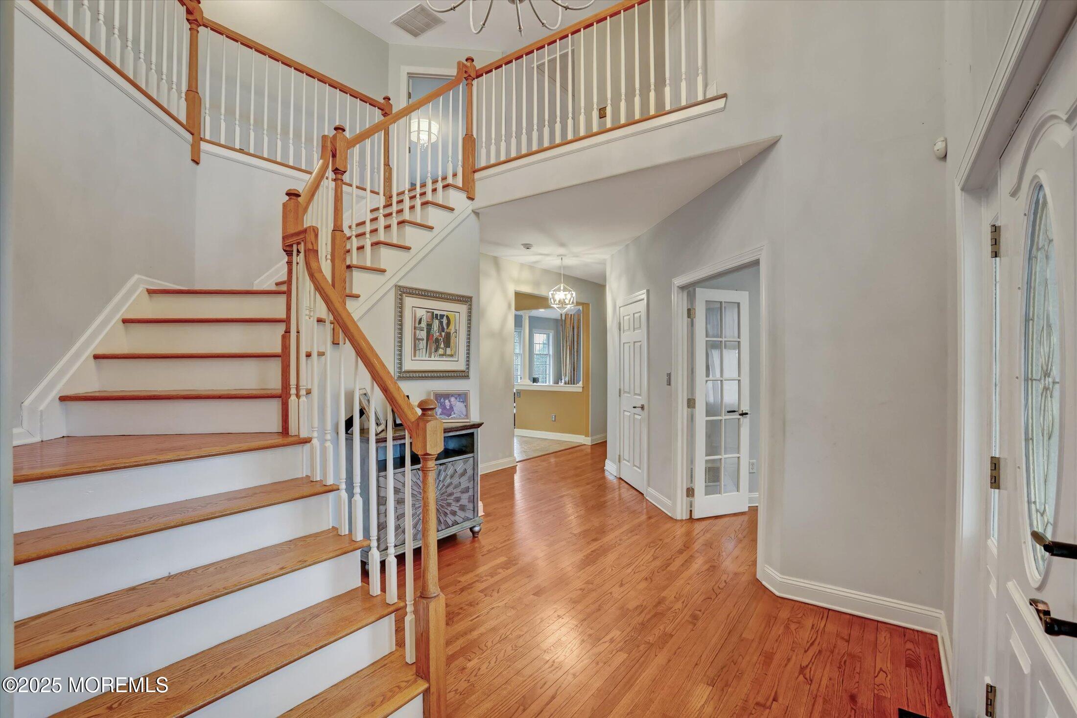 330 Randolph Road Freehold, NJ 07728 - Photo 19 of 63 a view of entryway with wooden floor and stairs