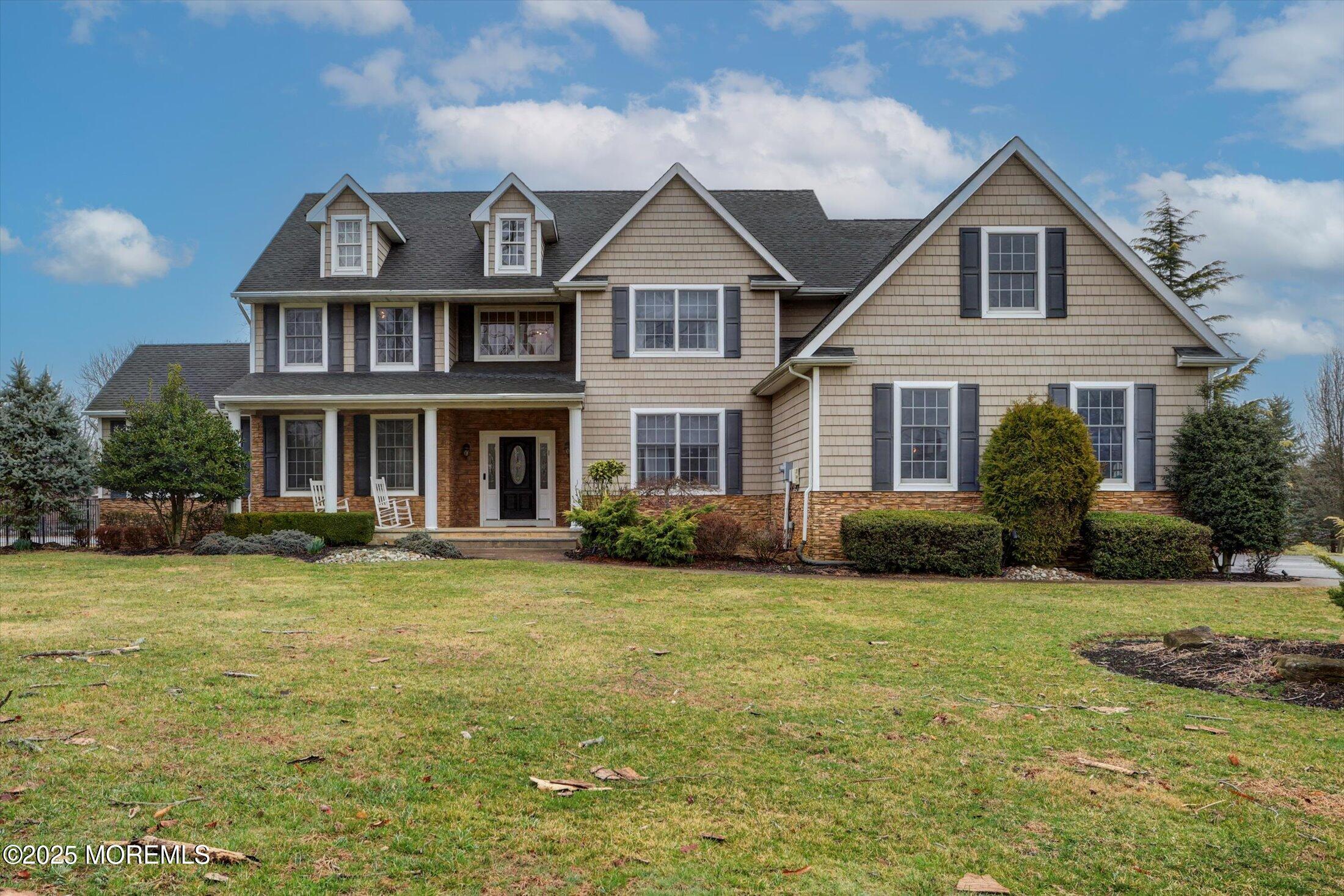 330 Randolph Road Freehold, NJ 07728 - Photo 2 of 63 a front view of a house with a yard