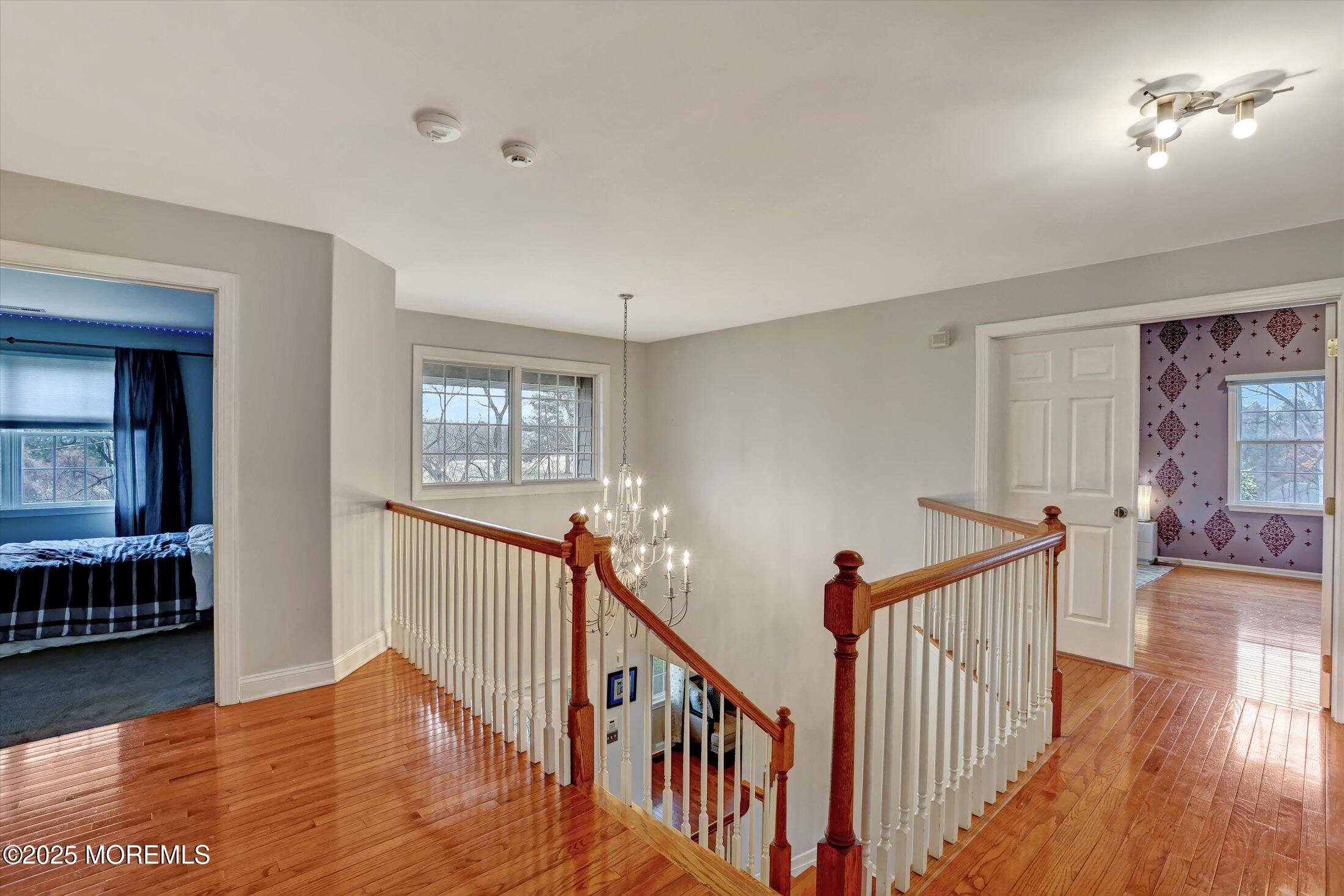 330 Randolph Road Freehold, NJ 07728 - Photo 27 of 63 a view of a hallway with wooden floor and windows