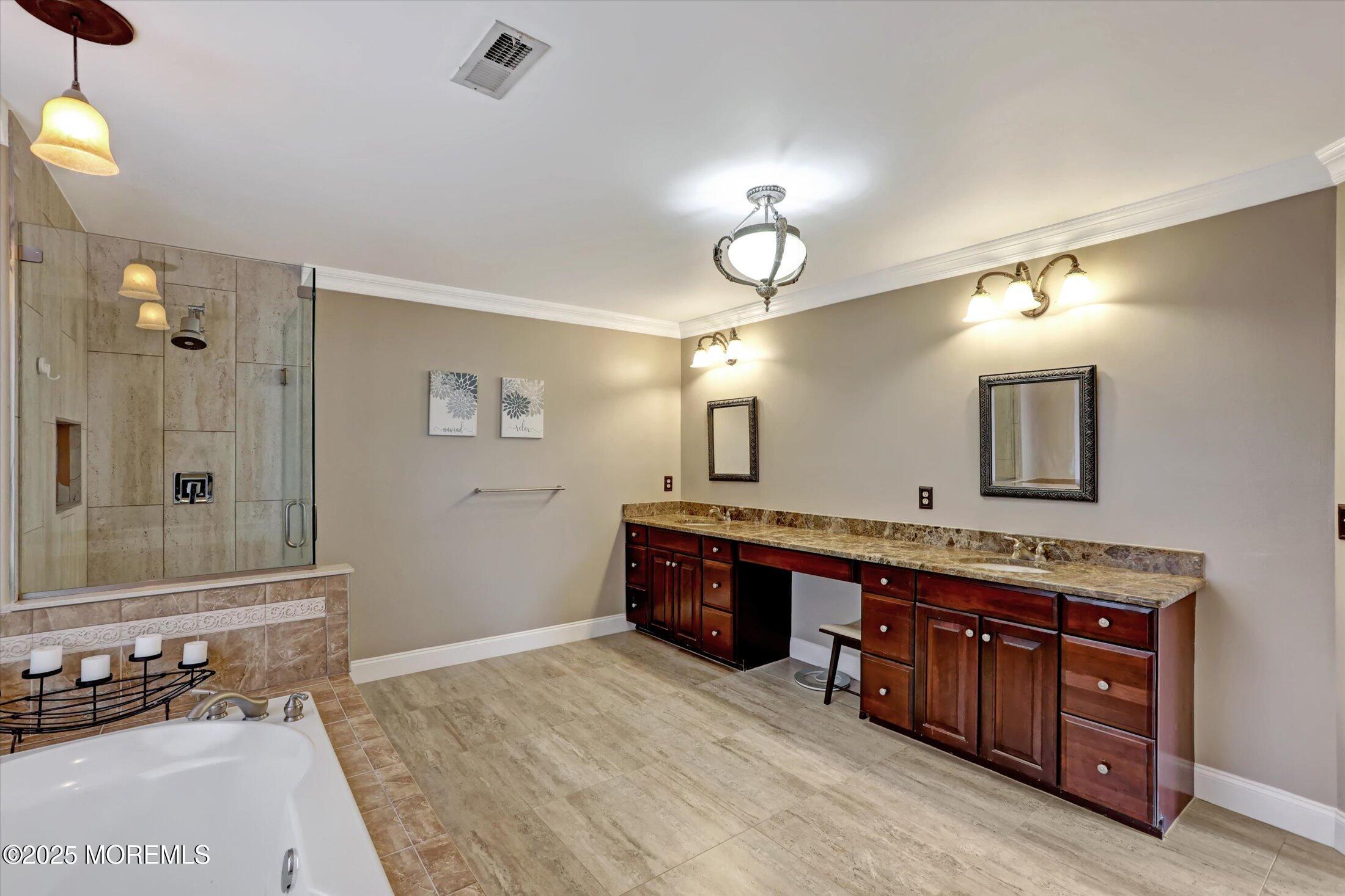330 Randolph Road Freehold, NJ 07728 - Photo 30 of 63 a spacious bathroom with a granite countertop double vanity sink a mirror and a bathtub