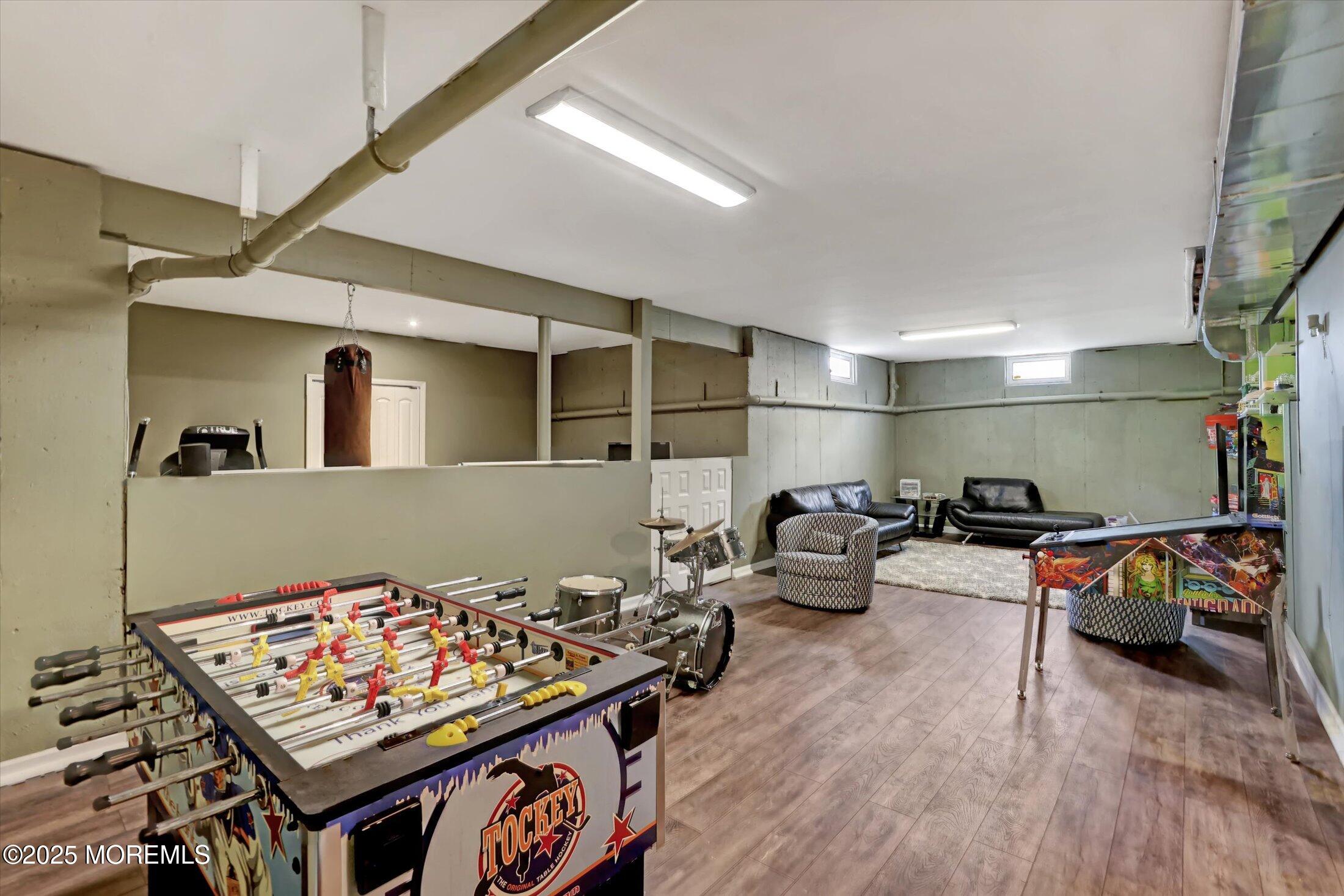 330 Randolph Road Freehold, NJ 07728 - Photo 49 of 63 a living room with furniture and a flat screen tv