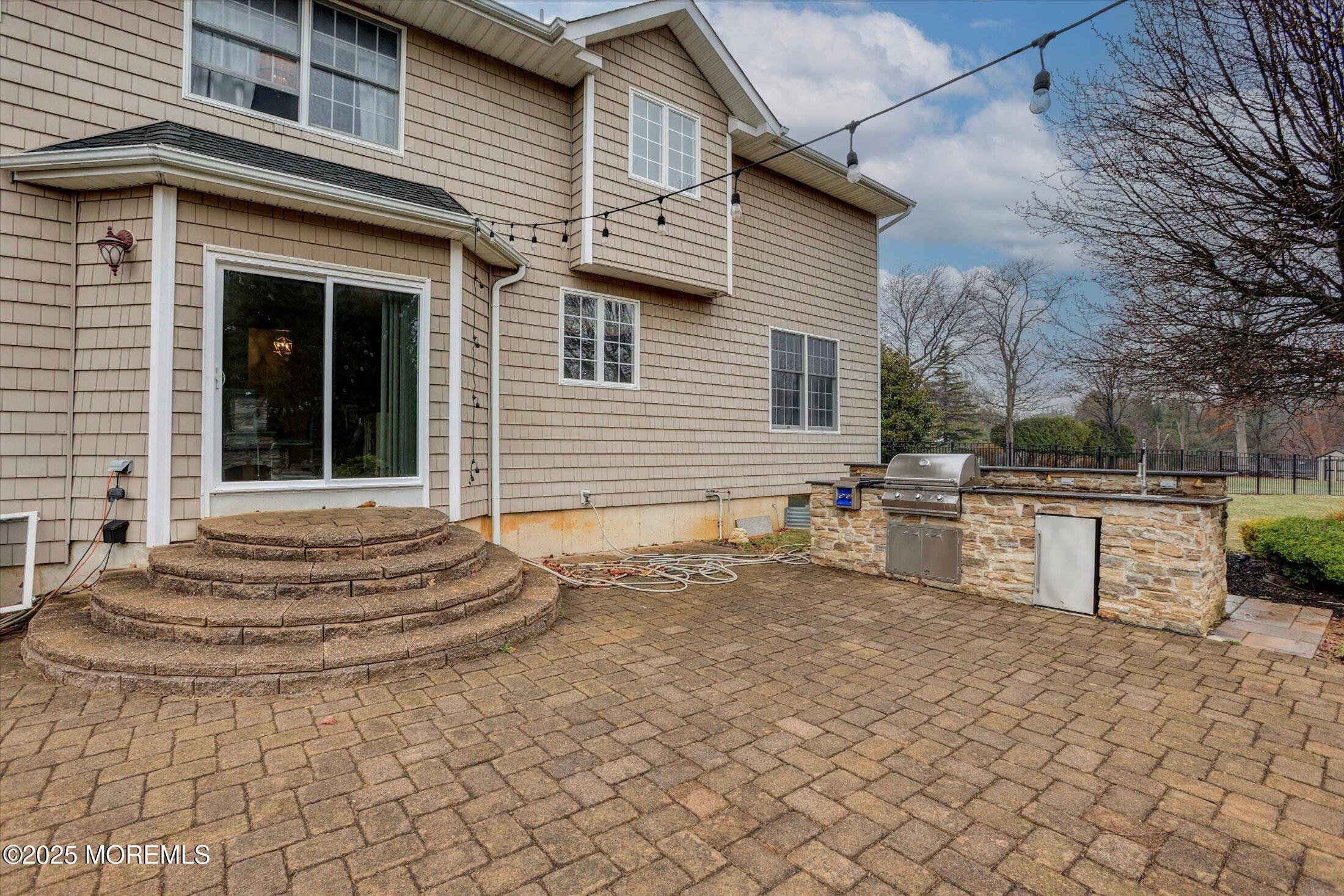 330 Randolph Road Freehold, NJ 07728 - Photo 51 of 63 a view of a chairs and table in the back yard of the house