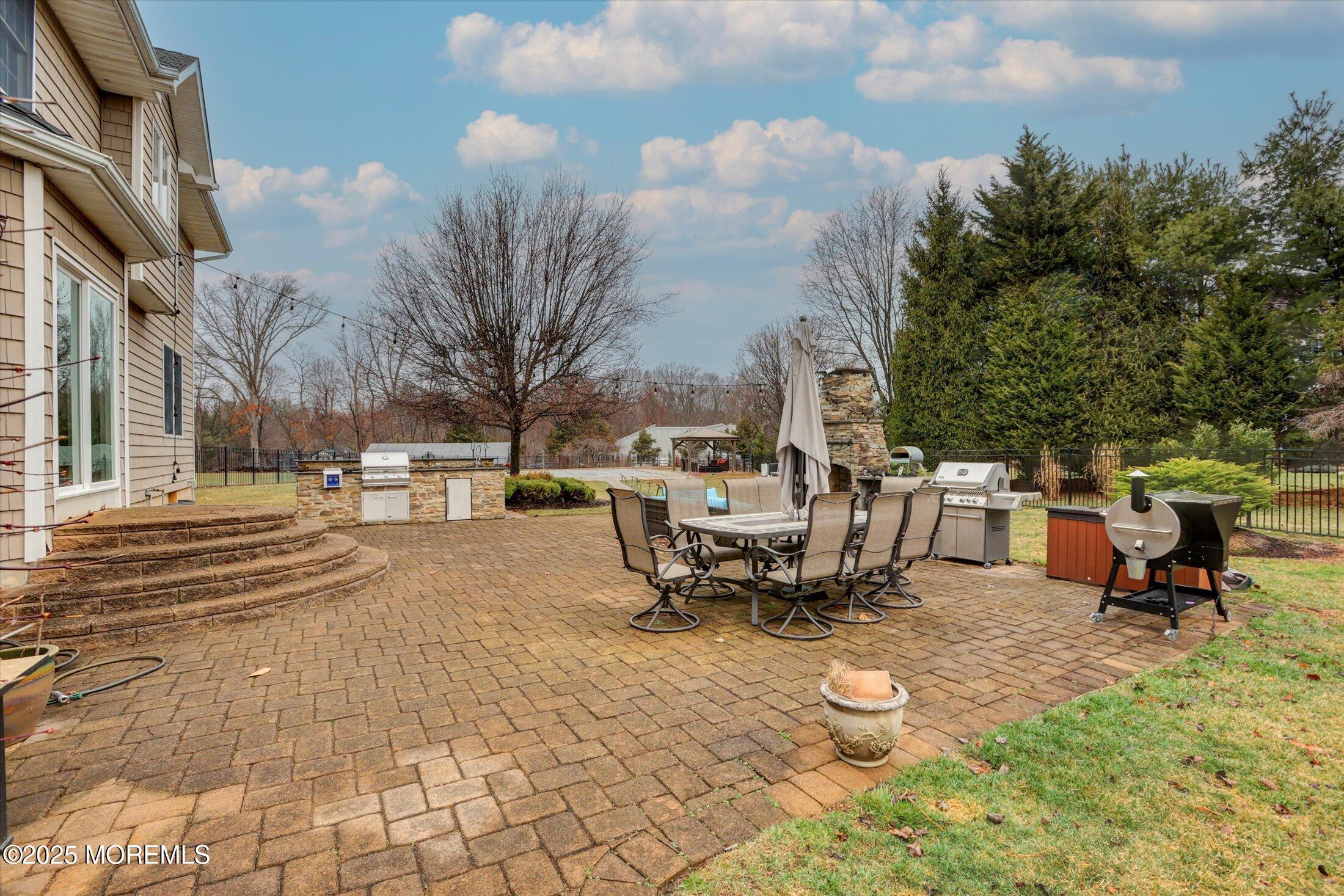 330 Randolph Road Freehold, NJ 07728 - Photo 53 of 63 a swimming pool with outdoor seating and trees
