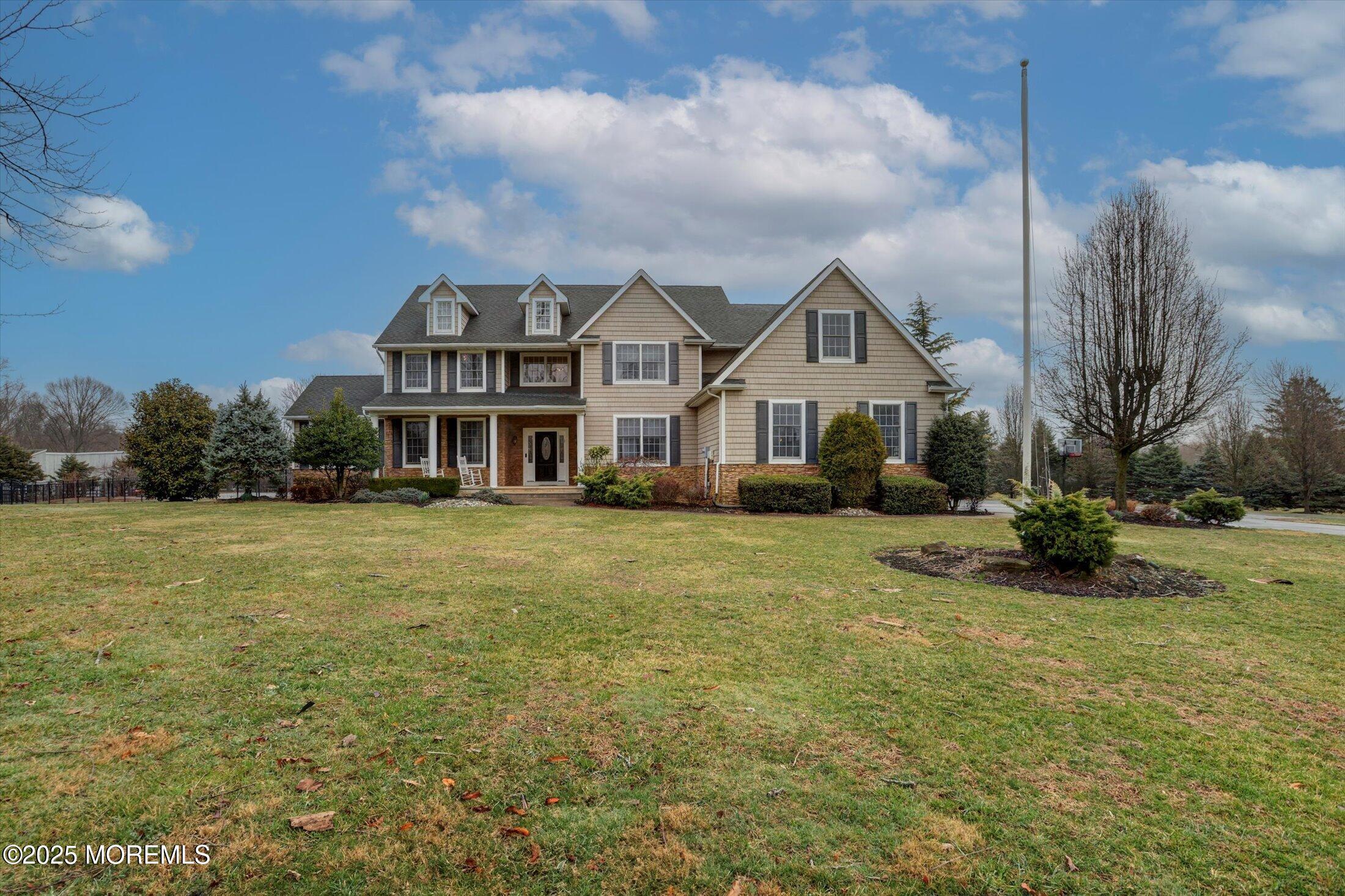 330 Randolph Road Freehold, NJ 07728 - Photo 6 of 63 a front view of house with yard and green space