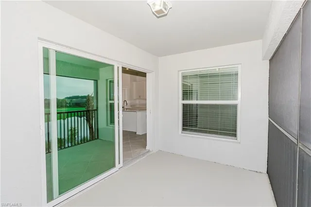 a view of an empty room with closet area