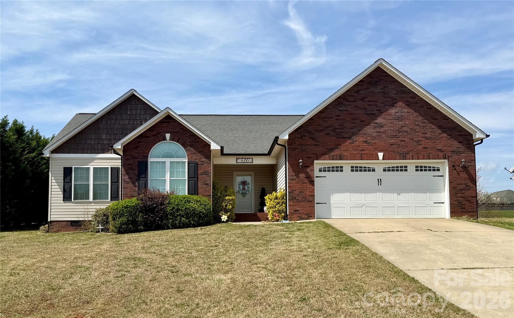 510 East Carpenter Street Maiden, NC 28650 - Photo 1 of 20 a front view of a house with a yard and garage