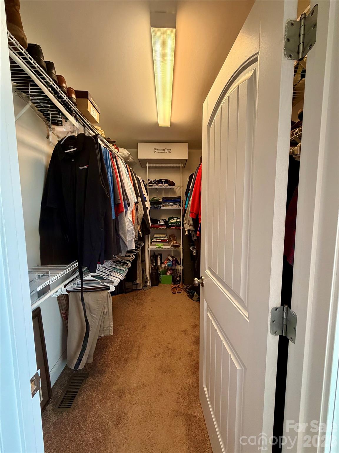 510 East Carpenter Street Maiden, NC 28650 - Photo 12 of 20 a view of walk in closet with clothes and shoes