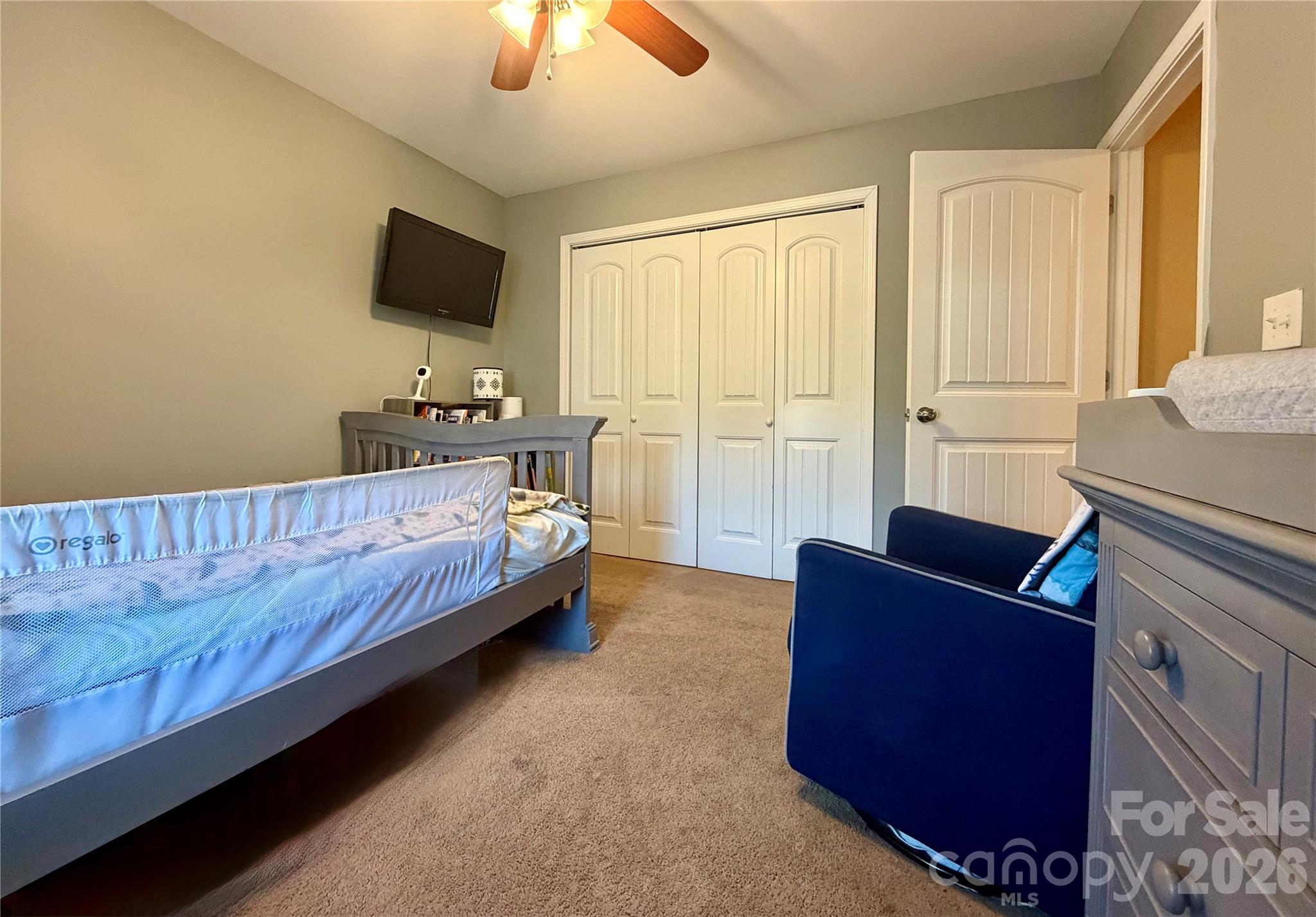 510 East Carpenter Street Maiden, NC 28650 - Photo 16 of 20 a bedroom with bed couch and window