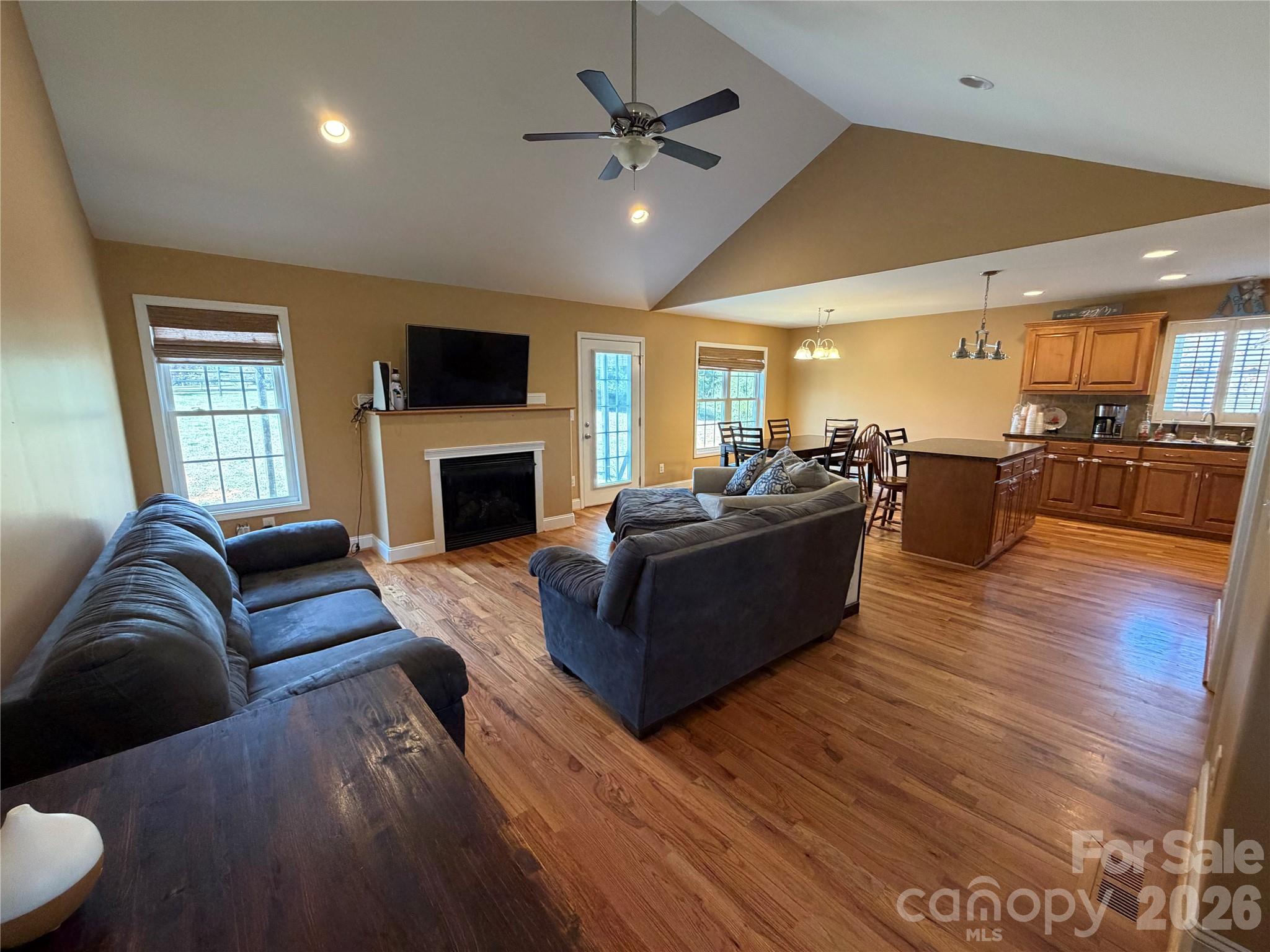 510 East Carpenter Street Maiden, NC 28650 - Photo 2 of 20 a living room with furniture fireplace and a flat screen tv