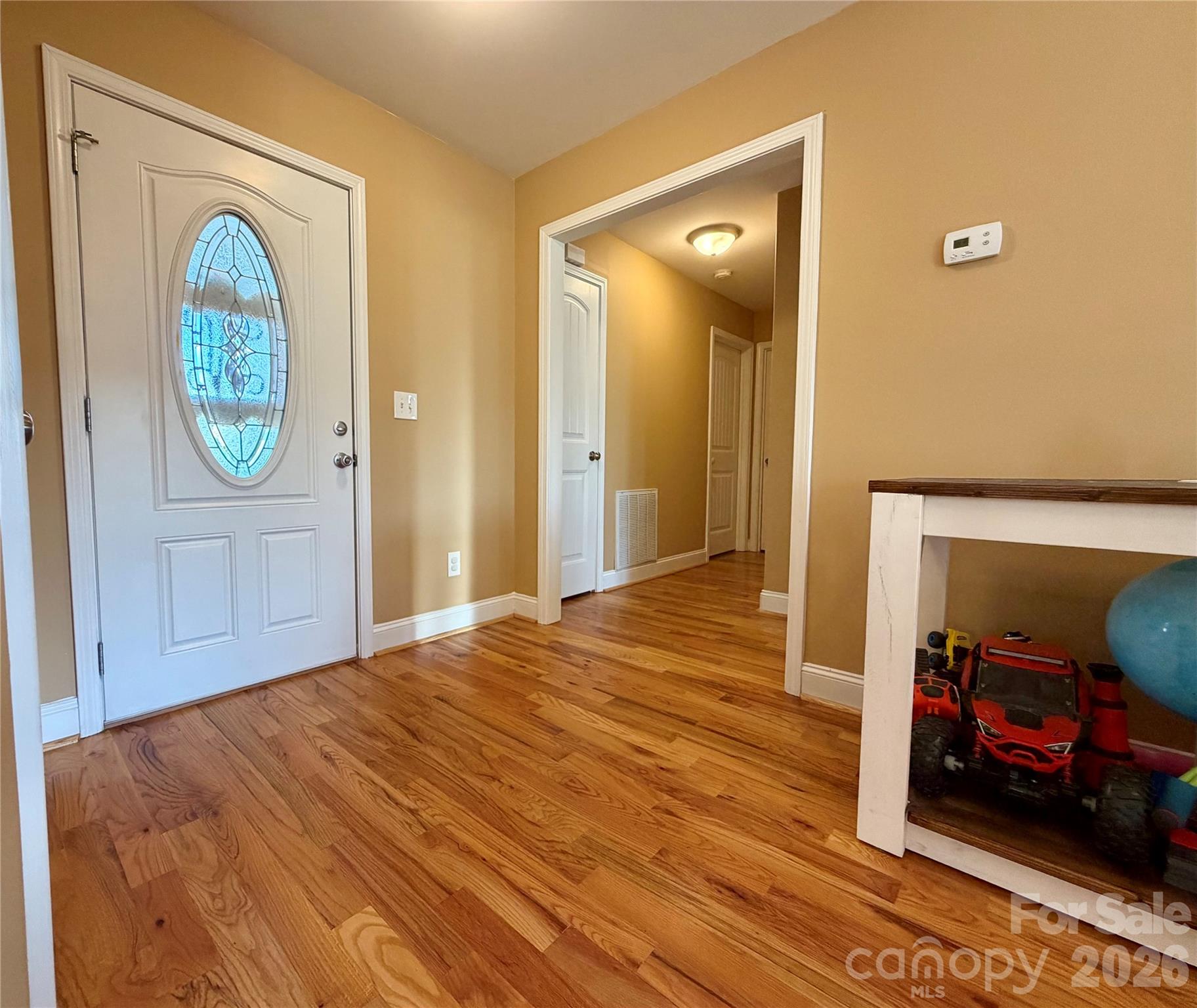 510 East Carpenter Street Maiden, NC 28650 - Photo 9 of 20 a view of a livingroom with wooden floor and entryway