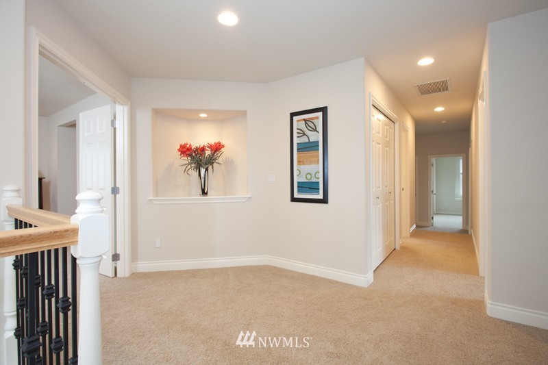 4806 Northeast 20th Place Renton, WA 98059 - Photo 14 of 17 a view of livingroom with furniture and a hallway
