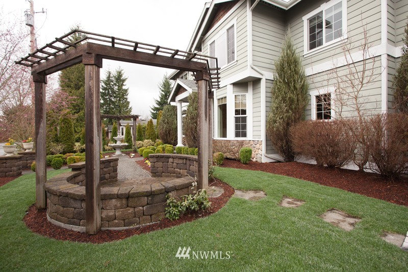 4806 Northeast 20th Place Renton, WA 98059 - Photo 16 of 17 a view of a house with backyard and garden