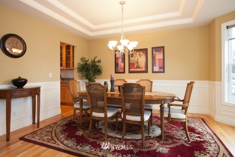 4806 Northeast 20th Place Renton, WA 98059 - Photo 3 of 17 a view of a dining room with furniture and wooden floor