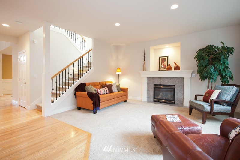 4806 Northeast 20th Place Renton, WA 98059 - Photo 9 of 17 a living room with furniture and a fireplace