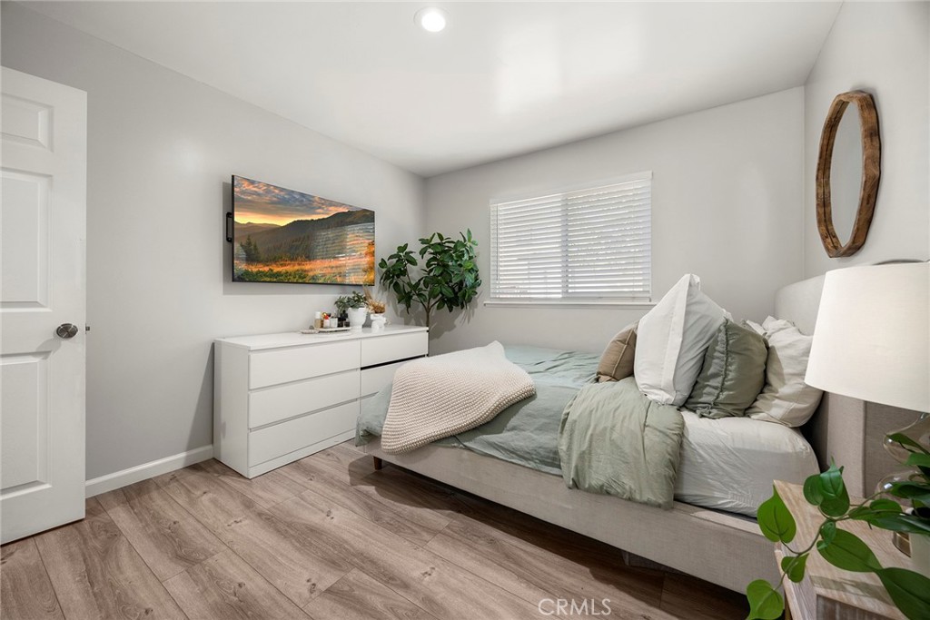 11629 185th Street Artesia, CA 90701 - Photo 12 of 20 a living room with furniture and a flat screen tv