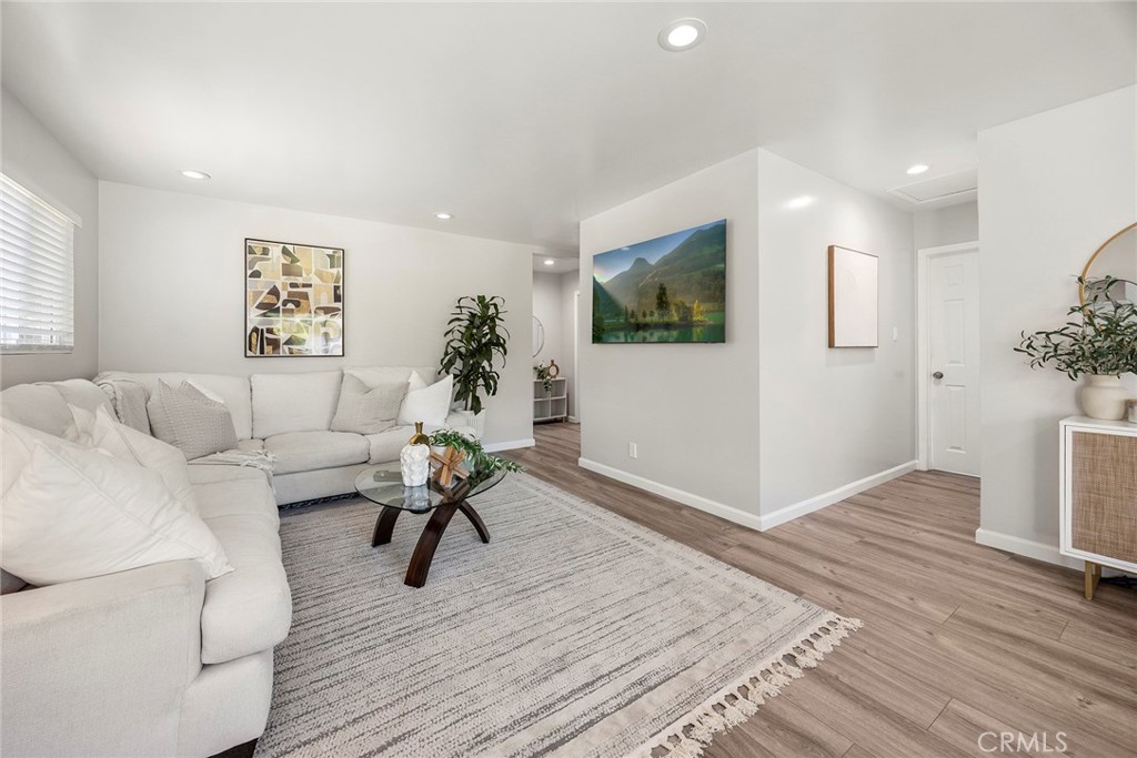 11629 185th Street Artesia, CA 90701 - Photo 3 of 20 a living room with furniture and a flat screen tv